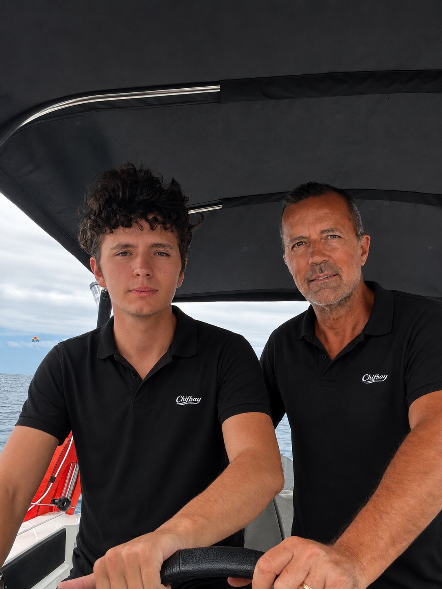 The two licensed Chifbay skippers at the helm of the boat in Funchal